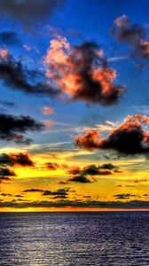 Preview wallpaper clouds, sea, sky, evening, shadows, yellow, dark blue, colors