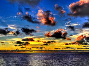 Preview wallpaper clouds, sea, sky, evening, shadows, yellow, dark blue, colors