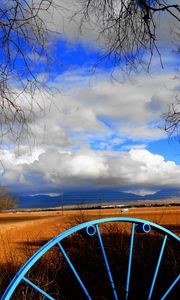 Preview wallpaper clouds, sky, field, wheel, iron