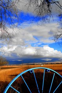 Preview wallpaper clouds, sky, field, wheel, iron