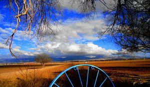 Preview wallpaper clouds, sky, field, wheel, iron