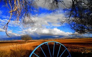 Preview wallpaper clouds, sky, field, wheel, iron