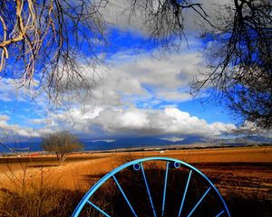 Preview wallpaper clouds, sky, field, wheel, iron