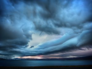 Preview wallpaper clouds, sky, gloomy, blackness, sea, smooth surface