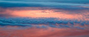 Preview wallpaper clouds, sky, porous, sunlight, sunset, sunrise