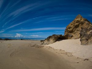 Preview wallpaper clouds, sky, stones, sand, coast, strips