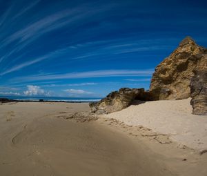 Preview wallpaper clouds, sky, stones, sand, coast, strips