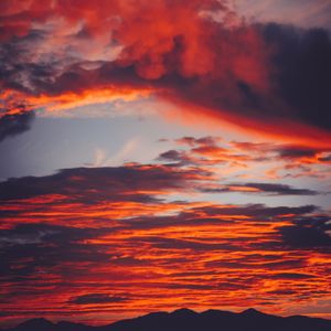 Preview wallpaper clouds, sky, sunset, red, porous, mountains, fiery