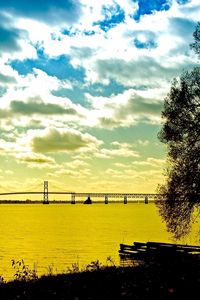 Preview wallpaper clouds, sky, water, coast, tree, bridge, morning, colors