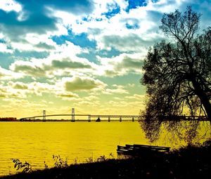 Preview wallpaper clouds, sky, water, coast, tree, bridge, morning, colors