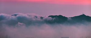 Preview wallpaper clouds, sunrise, mountain, dawn, fog, city