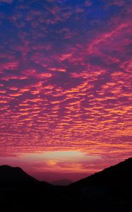Preview wallpaper clouds, sunset, hills, porous, evening