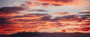 Preview wallpaper clouds, sunset, mountains, red, fiery