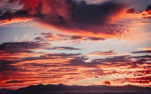 Preview wallpaper clouds, sunset, mountains, red, fiery