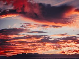 Preview wallpaper clouds, sunset, mountains, red, fiery