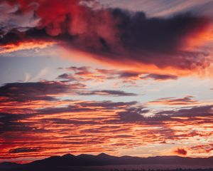 Preview wallpaper clouds, sunset, mountains, red, fiery