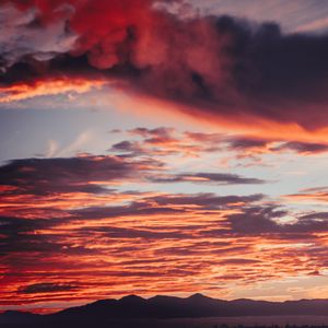 Preview wallpaper clouds, sunset, mountains, red, fiery