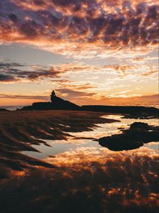 Preview wallpaper clouds, sunset, silhouette, sea, shore, reflection