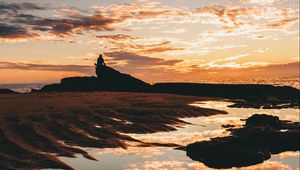 Preview wallpaper clouds, sunset, silhouette, sea, shore, reflection