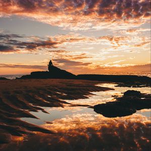 Preview wallpaper clouds, sunset, silhouette, sea, shore, reflection