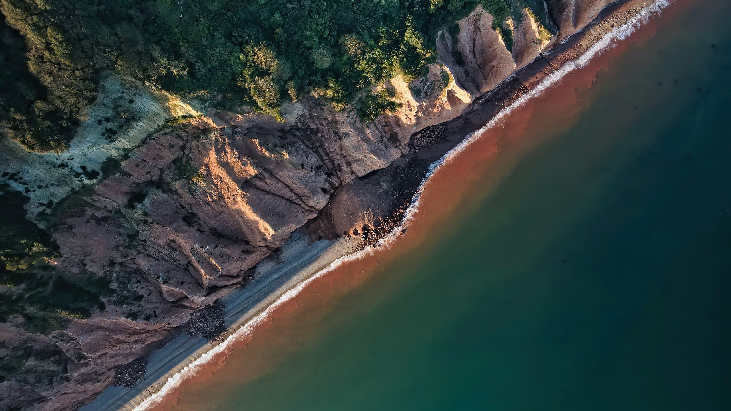 Download wallpaper 2560x1440 coast, aerial view, sea, rocks widescreen