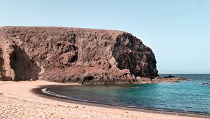 Preview wallpaper coast, beach, sand, rock, sea