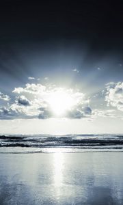 Preview wallpaper coast, beach, sun, clouds, beams, sand, black-and-white