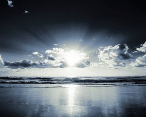 Preview wallpaper coast, beach, sun, clouds, beams, sand, black-and-white