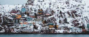 Preview wallpaper coast, buildings, cliff, mountains, snow