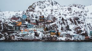 Preview wallpaper coast, buildings, cliff, mountains, snow