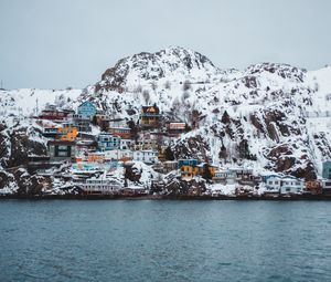 Preview wallpaper coast, buildings, cliff, mountains, snow