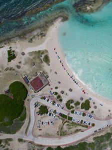 Preview wallpaper coast, buildings, island, sea, aerial view