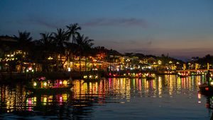 Preview wallpaper coast, buildings, lights, water, boats, dark