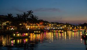 Preview wallpaper coast, buildings, lights, water, boats, dark