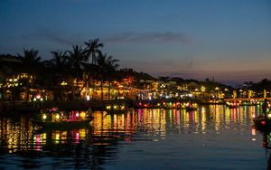 Preview wallpaper coast, buildings, lights, water, boats, dark