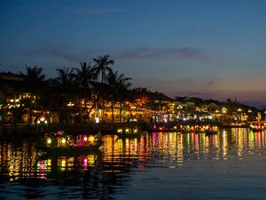 Preview wallpaper coast, buildings, lights, water, boats, dark