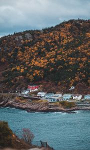 Preview wallpaper coast, buildings, rock, cliff, slope