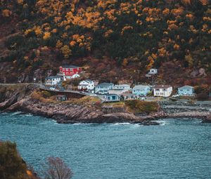 Preview wallpaper coast, buildings, rock, cliff, slope