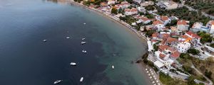 Preview wallpaper coast, buildings, sea, boats, aerial view