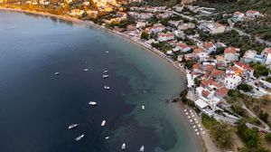 Preview wallpaper coast, buildings, sea, boats, aerial view