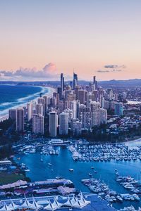 Preview wallpaper coast, city, buildings, evening