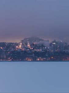 Preview wallpaper coast, city, buildings, clouds, dusk