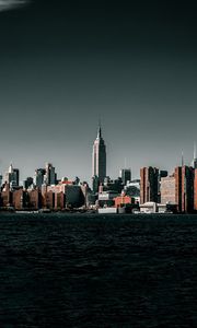 Preview wallpaper coast, city, cityscape, buildings, water, waves