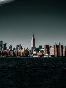 Preview wallpaper coast, city, cityscape, buildings, water, waves