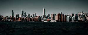 Preview wallpaper coast, city, cityscape, buildings, water, waves