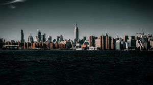 Preview wallpaper coast, city, cityscape, buildings, water, waves