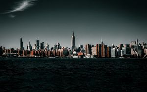 Preview wallpaper coast, city, cityscape, buildings, water, waves