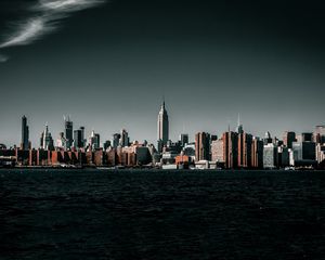 Preview wallpaper coast, city, cityscape, buildings, water, waves