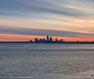 Preview wallpaper coast, city, water, ice, sunset