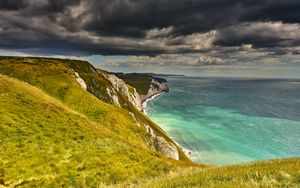 Preview wallpaper coast, cliff, rocks, sea, grass